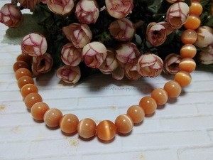 Бусины Кошачий глаз круглые 10мм, оранжевый 9 шт фото 1 — волшебные-ручки.рф